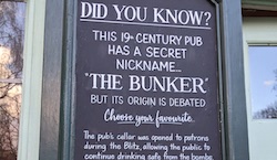 A sign that says: This 19th century pub has a secret nickname.. The Bunker